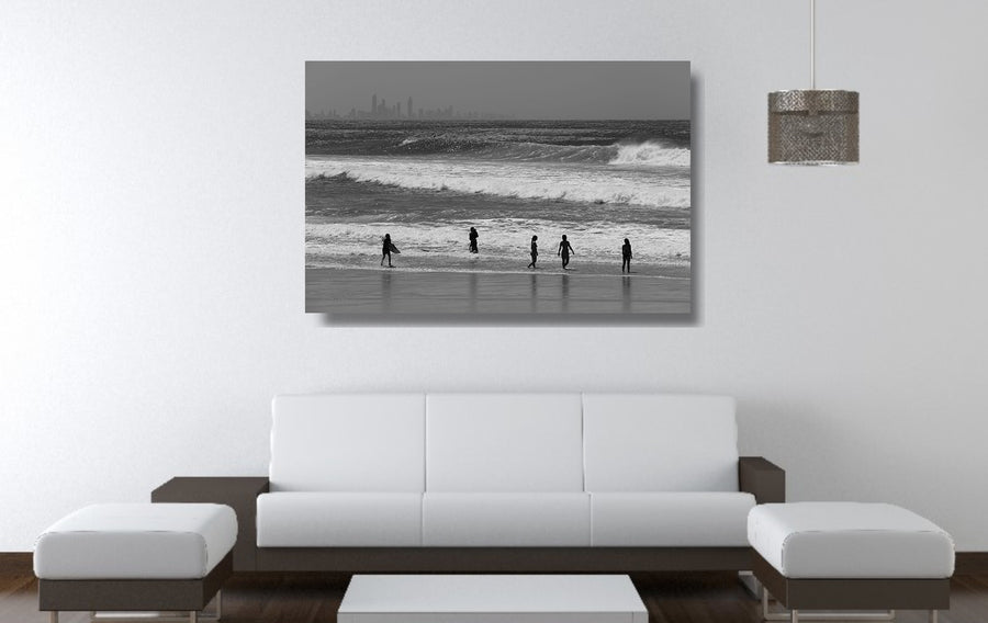 Black and white photograph of waves, people and buildings at Kirra Beach on the Gold Coast, QLD