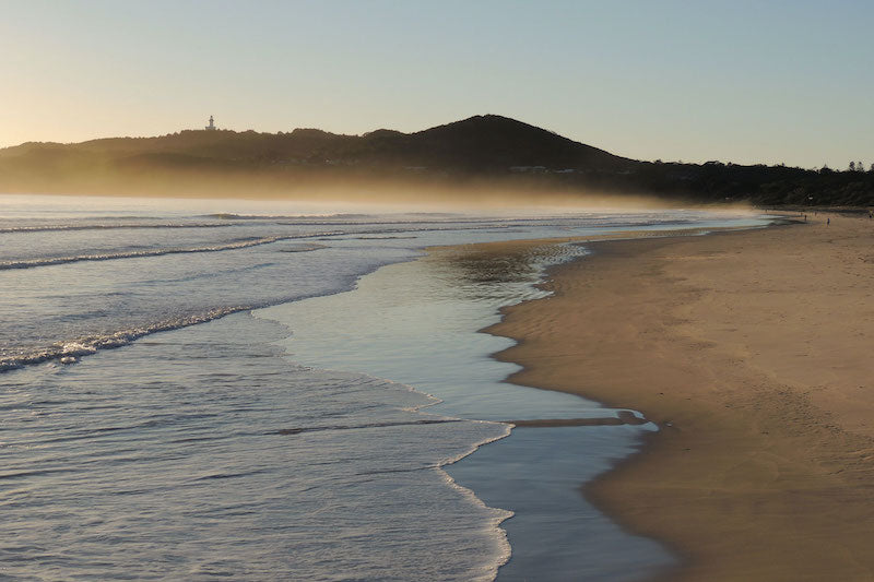 Early morning mist rising at Main Beach at Byron Bay
