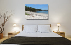 An acrylic print of a perfect sunny day at Barfleur Beach at Jervis Bay in NSW hanging in a bed room setting
