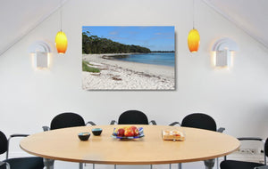 An acrylic print of a perfect sunny day at Barfleur Beach at Jervis Bay in NSW hanging in a dining room setting