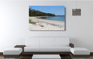 An acrylic print of a perfect sunny day at Barfleur Beach at Jervis Bay in NSW hanging in a lounge room setting