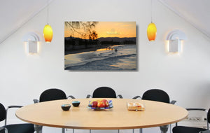 An acrylic print of a nice sunset at Belongil Beach, Byron Bay NSW hanging in a dining room setting
