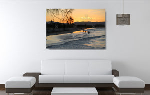 An acrylic print of a nice sunset at Belongil Beach, Byron Bay NSW hanging in a lounge room setting