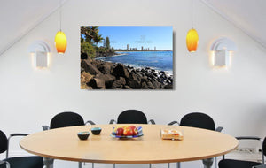 An acrylic print of a sunny day at Burleigh Heads on the Gold Coast in QLD hanging in a dining room setting