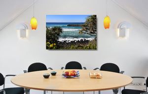 An acrylic print of Burleigh Heads on the Gold Coast, QLD hanging in a dining room setting