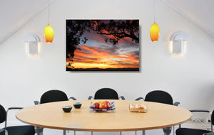 An acrylic print of a colourful sunset in Tamworth NSW in hanging in a dining room setting