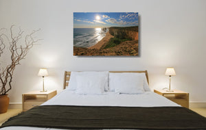 An acrylic print of the Twelve Apostles VIC hanging in a bed room setting