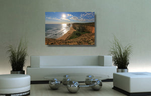 An acrylic print of the Twelve Apostles VIC hanging in a lounge room setting
