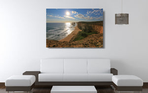 An acrylic print of the Twelve Apostles VIC hanging in a lounge room setting