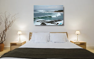 An acrylic print of the rivermouth at Margaret River in WA hanging in a bedroom setting