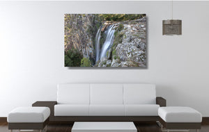 An acrylic print of Minyon Falls in NSW hanging in a lounge room setting