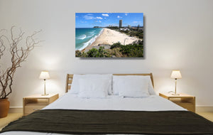 An acrylic print of North Burleigh Beach in QLD hanging in a bed room setting