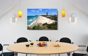 An acrylic print of North Burleigh Beach in QLD hanging in a dining room setting