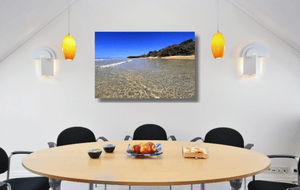 An acrylic print of the crystal clear waters of Cylinder Beach on North Stradbroke Island QLD hanging in a dining room setting