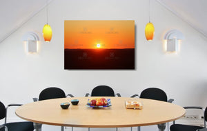 An acrylic print of a perfect sunset in outback NSW hanging in a dining room setting