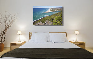An acrylic print of Palm Beach on the Gold Coast, QLD hanging in a bed room setting