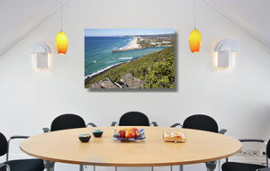 An acrylic print of Palm Beach on the Gold Coast, QLD hanging in a dining room setting