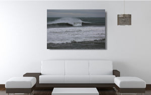 An acrylic print of Sandon Point in Wollongong NSW hanging in a lounge room setting