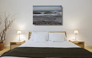 An acrylic print of Sandon Point in Wollongong NSW hanging in a bed room setting