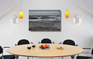 An acrylic print of Sandon Point in Wollongong NSW hanging in a dining room setting