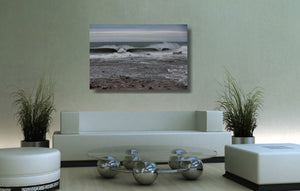 An acrylic print of Sandon Point in Wollongong NSW hanging in a lounge room setting