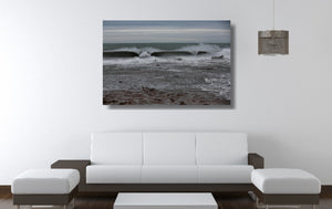 An acrylic print of Sandon Point in Wollongong NSW hanging in a lounge room setting