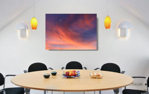 An acrylic print of a soft pastel sunset at Paradise Point QLD in hanging in a dining room setting