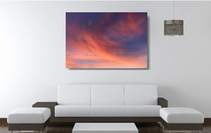 An acrylic print of a soft pastel sunset at Paradise Point QLD in hanging in a lounge room setting