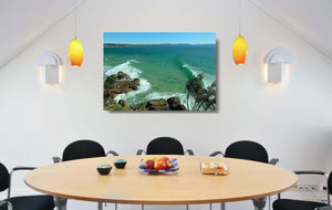 An acrylic print of The Pass at Byron Bay NSW hanging in a dining room setting