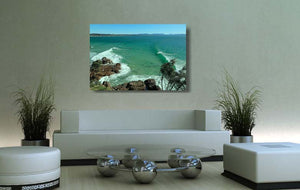 An acrylic print of The Pass at Byron Bay NSW hanging in a lounge room setting
