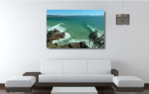 An acrylic print of The Pass at Byron Bay NSW hanging in a lounge room setting