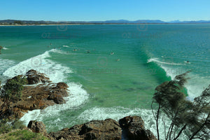 Photograph of surfers on a sunny day - The Pass, Byron Bay NSW