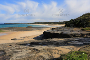 Photograph of a sunny, uncrowded day at Racecourse Beach, Ulladulla NSW